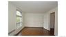 Hardwood flooring and built-in cabinetry enhance this room