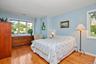 Primary Bedroom on first floor has hardwood floors