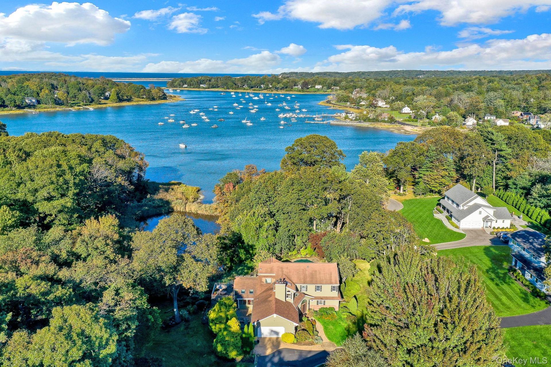 House in foreground with Setauket Harbor