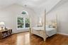 Principal suite with vaulted ceiling and two oversized walk-in closets