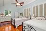 Second floor Primary Bedroom has ceiling fan with light