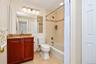 First floor Primary Bathroom has a sink with vanity and bathtub with shower combo