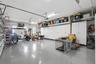 3 car garage with cabinets and tool bench epoxy floors