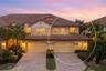 A warm welcome home, with a spacious driveway and oversized two-car plus golf cart garage.