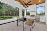 Covered lanai with motorized retractable screens