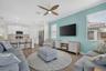 Living Room with large mounted T.V.