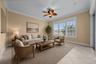 Just off the kitchen, this comfortable gathering space opens directly to the screened lanai.