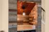 Wood accents, a decorative ceiling, and pendant lighting make this custom wine nook a conversation piece.