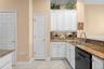 Plenty of cabinet space and a pantry keep kitchen essentials close at hand.