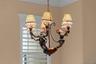 A distinctive chandelier brings character and a warm finishing touch to the dining room.