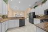 An open kitchen layout offers ample prep space while keeping you connected to family and guests.
