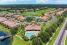 A beautiful aerial look at Miramar’s lakes, golf course surroundings, and community pool.