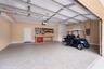 Extra built in custom storage and an epoxy-finished floor make this garage a standout feature.
