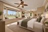 A spacious, light-filled retreat with expansive windows, a built-in window seat, and beautiful views.