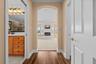 An arched entry leads into the primary retreat, with the ensuite bath close at hand.