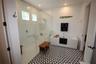 WALK-IN SHOWER WITH BUILT-IN BENCH AND FREESTANDING SOAKING TUB