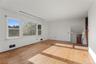 Natural light and hardwood floors provide a wonderful foundation for a beautifully reimagined living space.