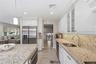 Updated kitchen with stainless steel appliances and granite countertops