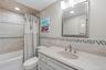 Updated bathroom with tub
