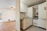 The additional kitchen and adjoining living space offer intriguing options for reimagining how the home functions.
