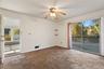 Sliding glass doors connect this flexible living space with the outdoors, creating exciting potential for expanded everyday living.