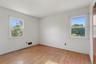 Hardwood floors, natural light and a peaceful outlook create a versatile private space.