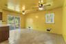 A spacious dining area extends from the kitchen and opens directly to the deck, creating an inviting setting for everyday meals, entertaining and easy