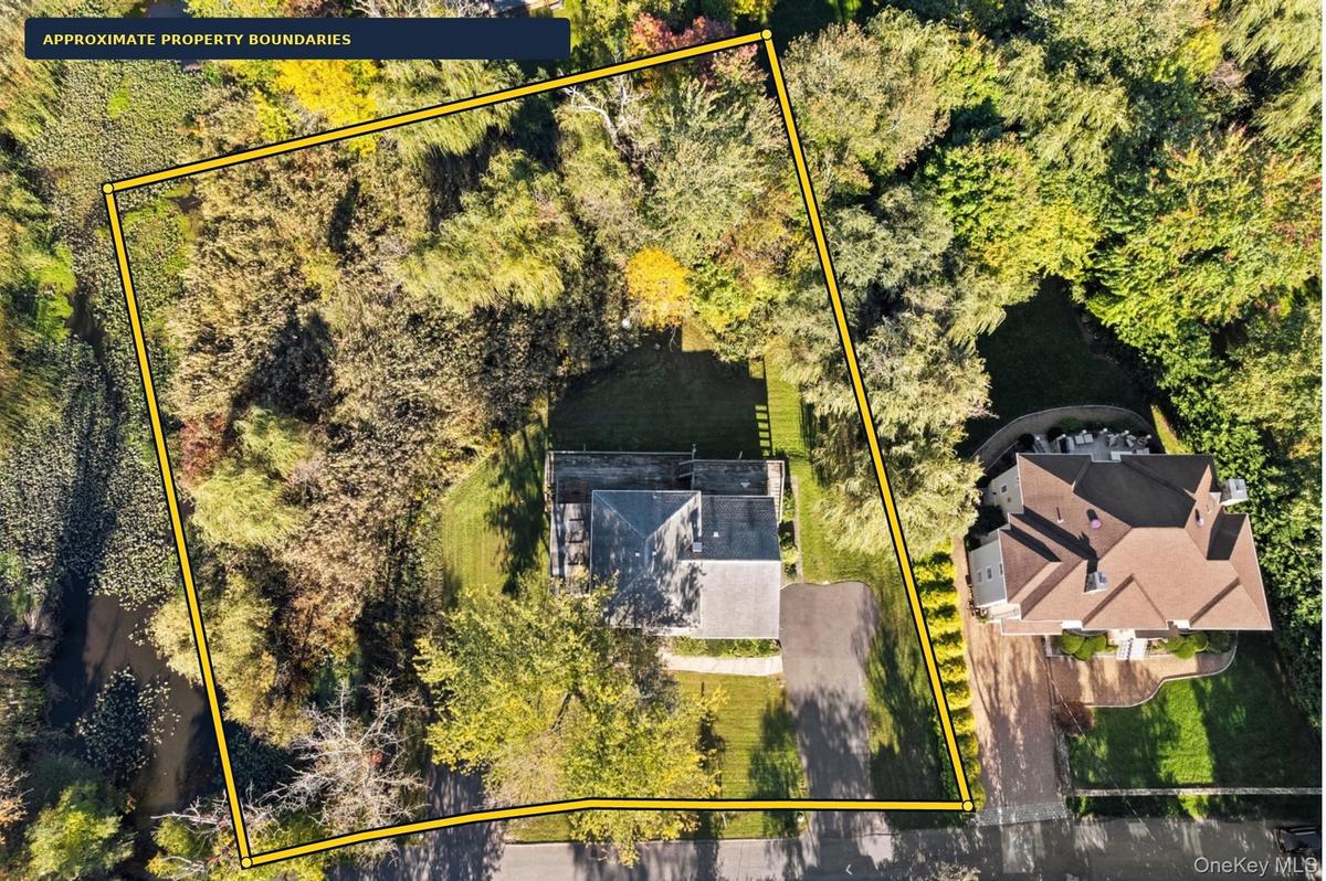 The aerial survey overlay illustrates the scale of this .77-acre property and the possibilities it presents. Boundary depiction is approximate; refer 