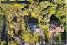 The aerial survey overlay illustrates the scale of this .77-acre property and the possibilities it presents. Boundary depiction is approximate; refer 