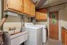 A dedicated laundry and utility area adds practical functionality to the home.
