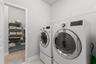 Smart connection to laundry from Primary bedroom closet.