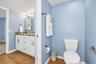 Primary Bathroom, newly updated with double sink shaker cabinet vanity with soft close drawers, lighting, mirrors and paint.