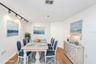 Option 2 for den = dining room furniture virtually staged