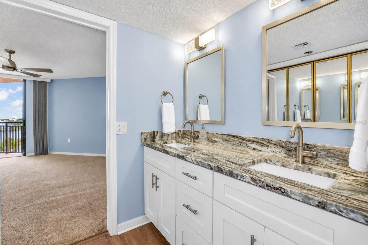 Updated primary bathroom with double vanity and closet remodel