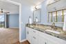 Updated primary bathroom with double vanity and closet remodel