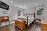 Wood-finish flooring, recessed lighting, and crown molding
