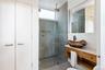 Second Bathroom on First Floor with Laundry and Storage