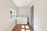 Main level laundry room and door to utility closet for gas burner