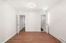 With door to upstairs and another to outside side entry