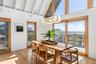With dining area and sliding doors to 2nd story deck overlooking the ocean.