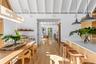 With 1x6 cedar tongue and groove ceilings with hardwood accents.