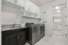 Laundry Room is conveniently adjoined to the primary bedroom closet