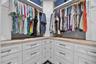 Look How Beautifully Designed This Custom Built Walk-In Closet Is!