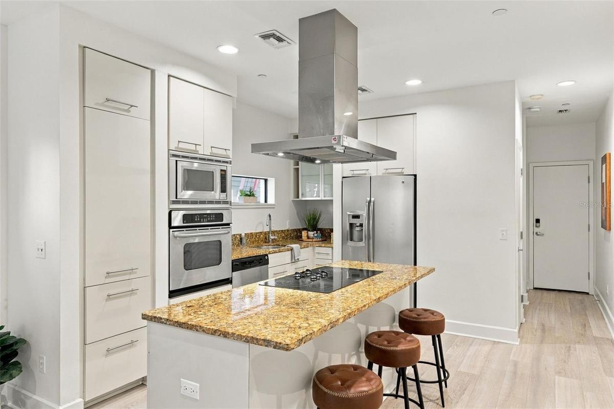 and opens to kitchen