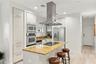 and opens to kitchen