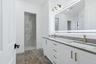 primary bath with lighted mirror