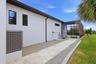 Walkway between the Garage and Lanai with enough space for a small gardening or storage shed