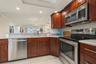 Looking over the Breakfast Bar and into the Dining and Living Rooms