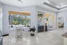 Breakfast Room w/aquarium window; slider to lanai and pool