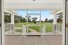 Expansive rear screened porch.